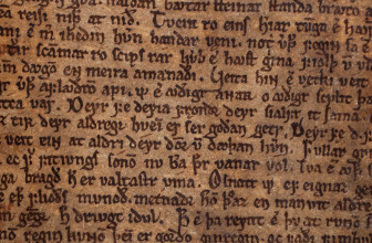Writing on a brown manuscript page.
